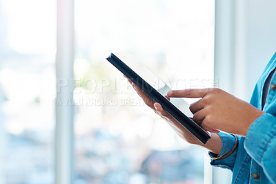 Buy stock photo Closeup shot of an unrecognisable businesswoman using a digital tablet in an office