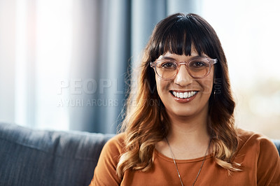 Buy stock photo Cropped shot of a beautiful young woman relaxing on the sofa at home