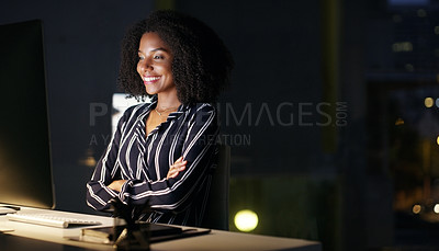 Buy stock photo Cropped shot of an attractive young businesswoman sitting at her desk in the office late at night