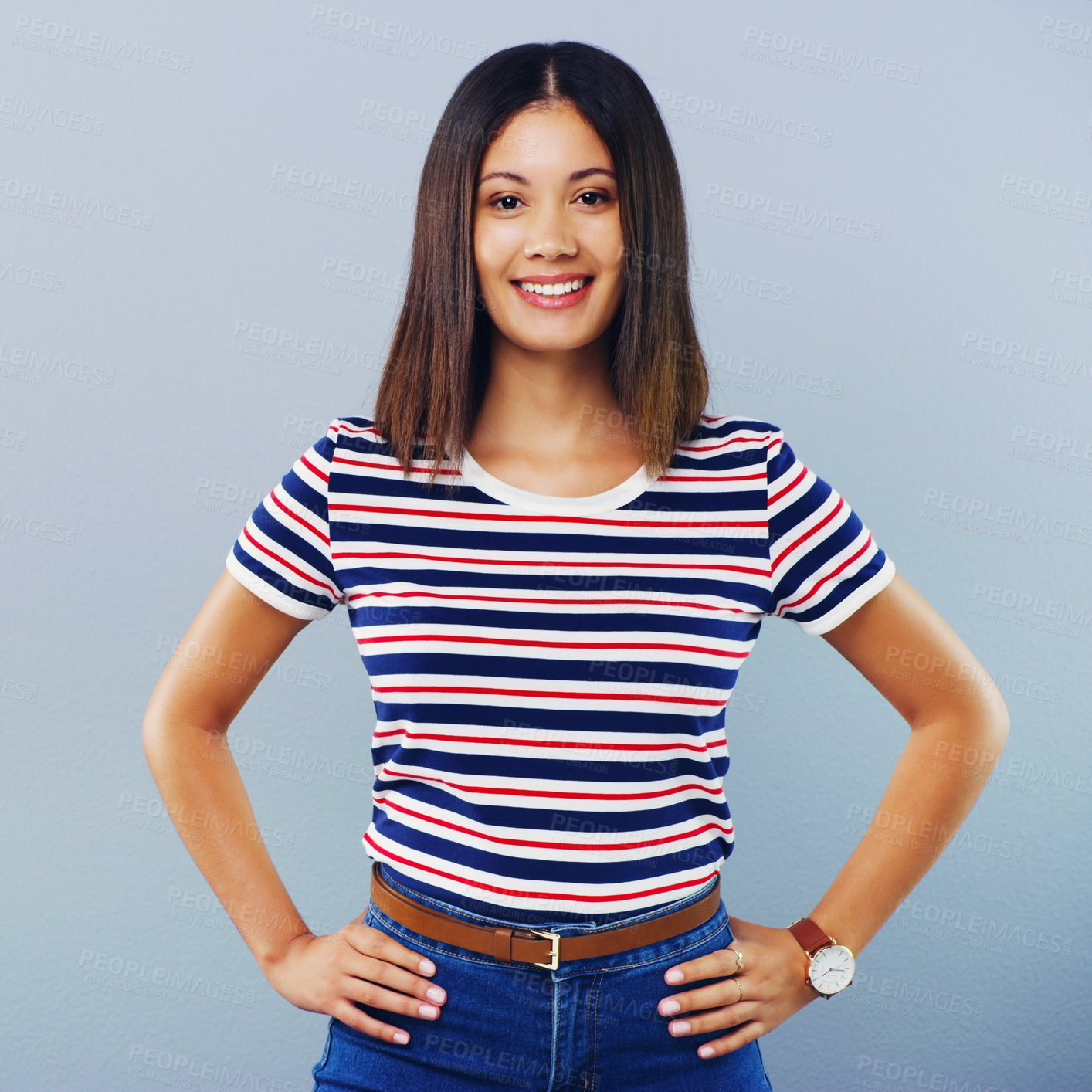 Buy stock photo Studio shot of a confident young woman posing against a grey background