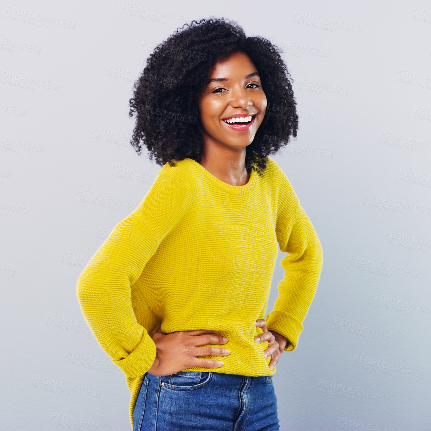 Buy stock photo Studio shot of a confident young woman posing against a grey background