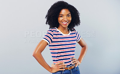Buy stock photo Studio shot of a confident young woman posing against a grey background