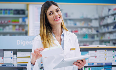 Buy stock photo Cropped shot of a female pharmacist working in a chemist
