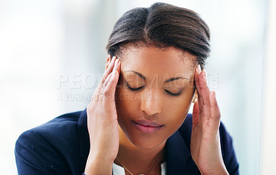 Buy stock photo Shot of a young businesswoman experiencing stress while working in a modern office