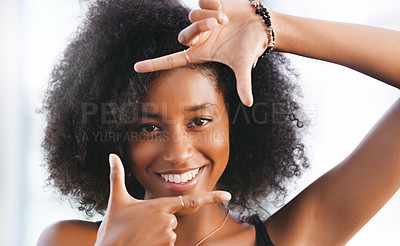 Buy stock photo Portrait of a confident young woman making a finger frame