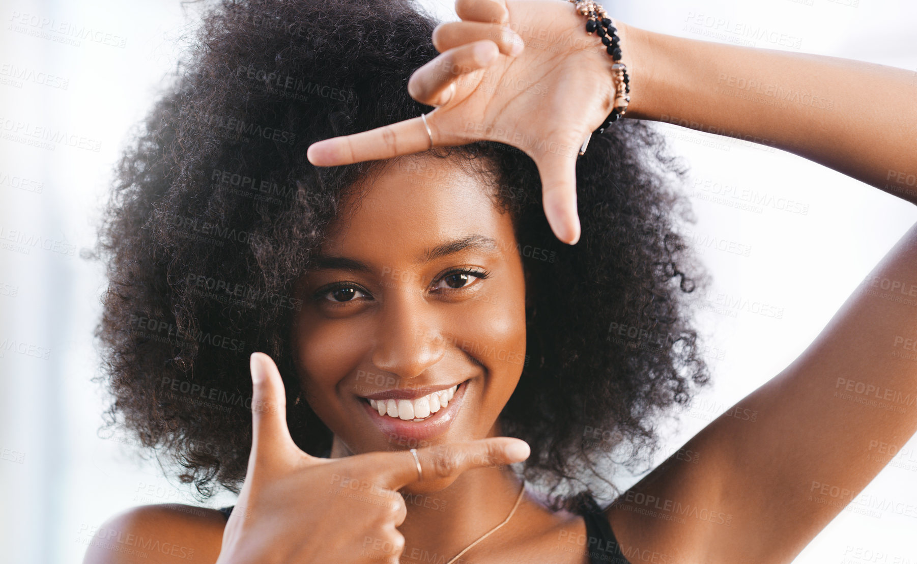 Buy stock photo Portrait of a confident young woman making a finger frame