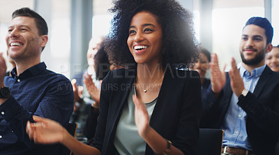 Buy stock photo Shot of a group of businesspeople clapping while attending a conference