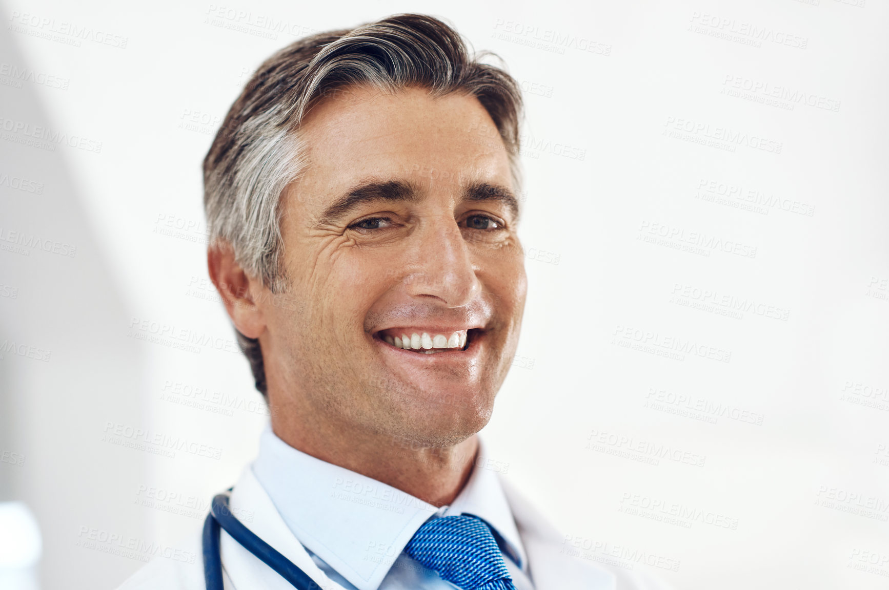 Buy stock photo Portrait, doctor and man in clinic, cheerful or stethoscope with wellness, career ambition or trust. Face, mature or medical with professional, pride or employee with cardiology or expert in hospital