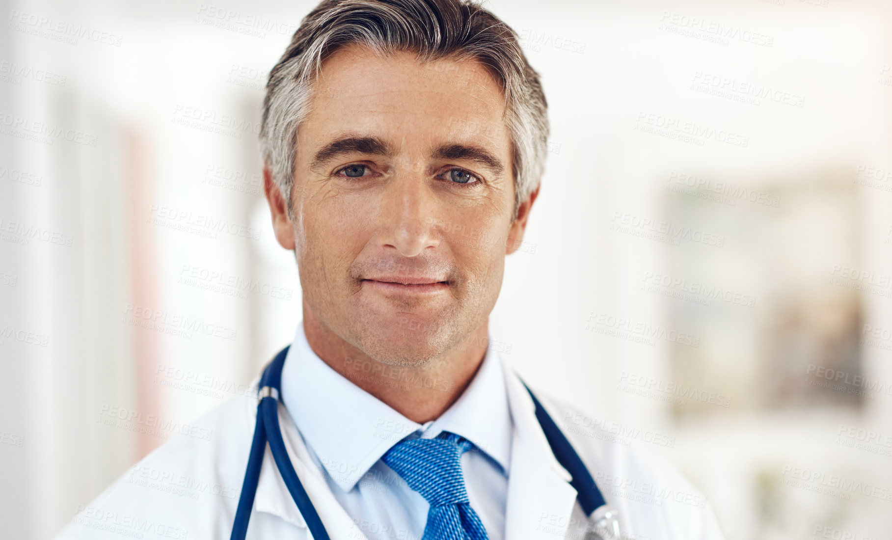 Buy stock photo Portrait, doctor and man in clinic, employee and stethoscope with wellness, white coat and pride. Face, person or medical with professional, worker or cardiology with expert or consultant in hospital