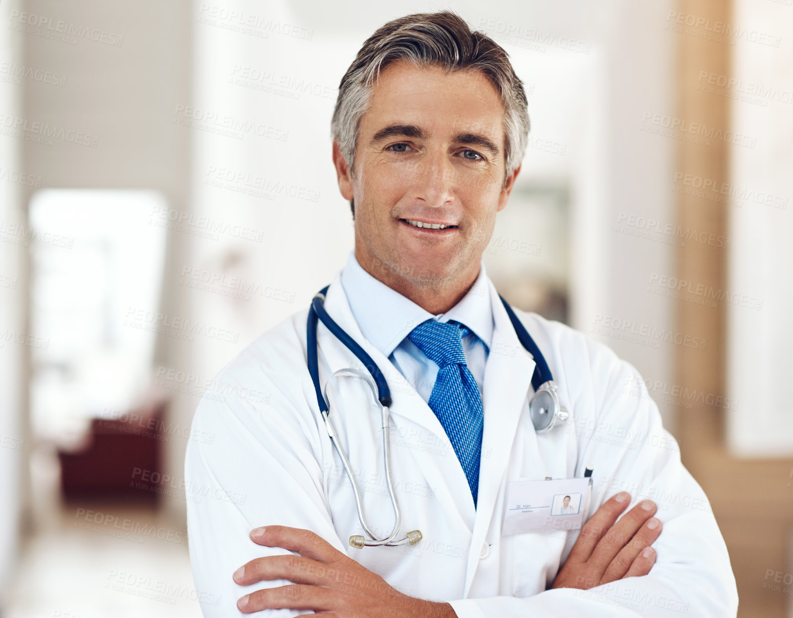 Buy stock photo Smile, healthcare and portrait of doctor with crossed arms in hospital with positive, confident and pride. Happy, medical and professional mature male cardiology surgeon from Australia work in clinic