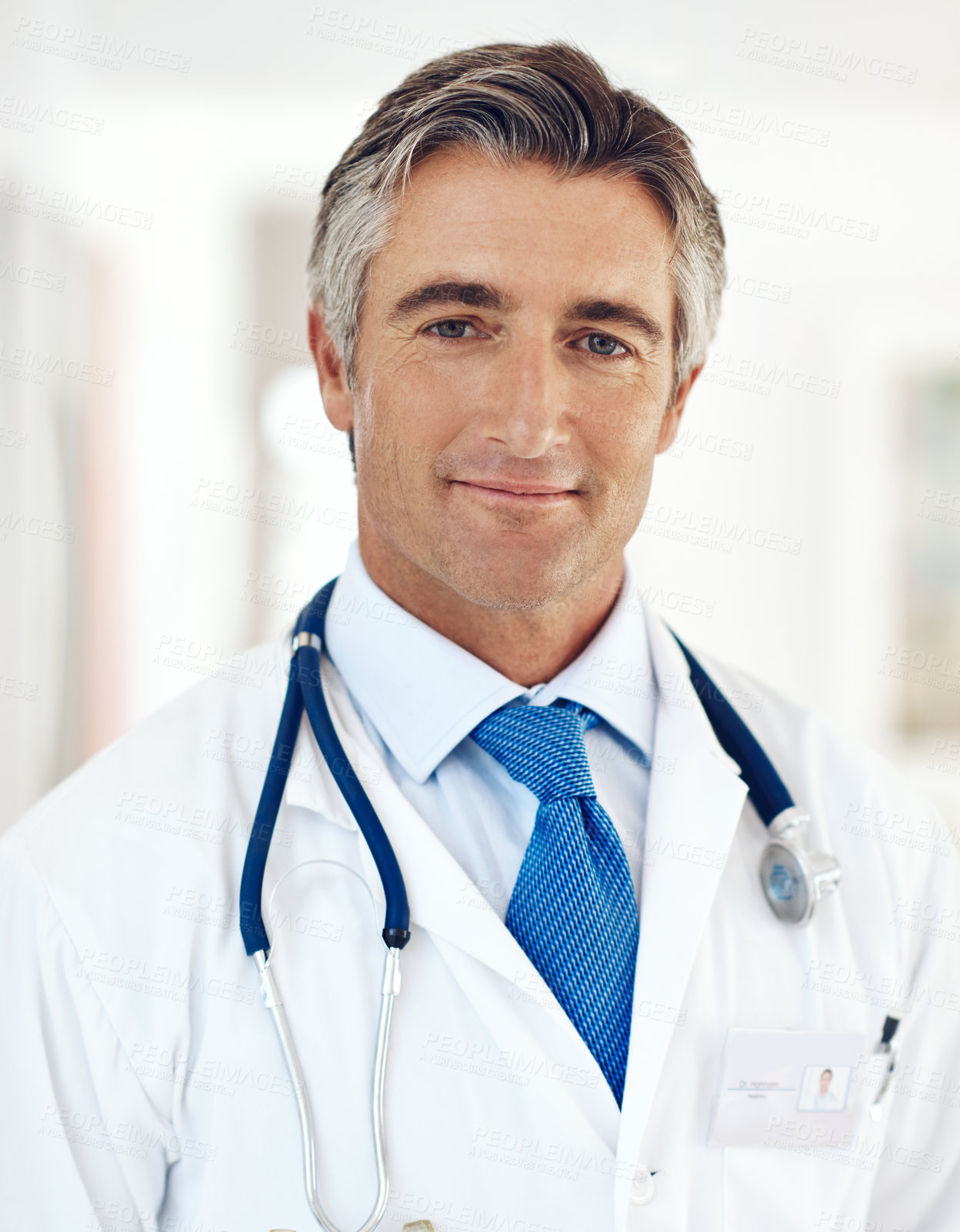 Buy stock photo Portrait, doctor and man in clinic, career ambition and stethoscope with wellness, tools and pride. Face, person or medical with professional, gp and employee with cardiology or expert in hospital