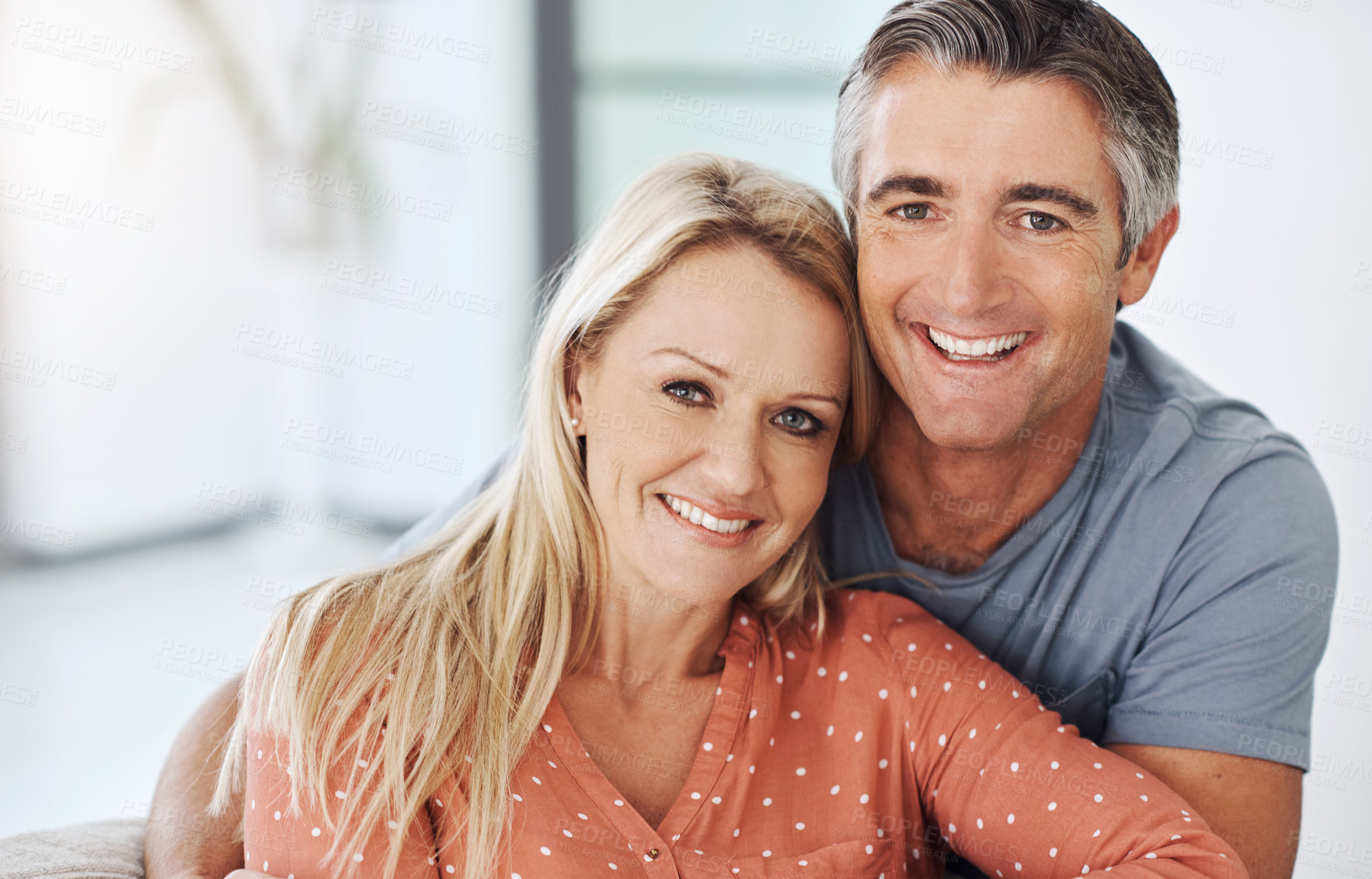 Buy stock photo Portrait, couple and happy with love at house with care, marriage commitment and healthy relationship. Smile, woman and man with embracing for support, trust and bonding together of loyalty in lounge