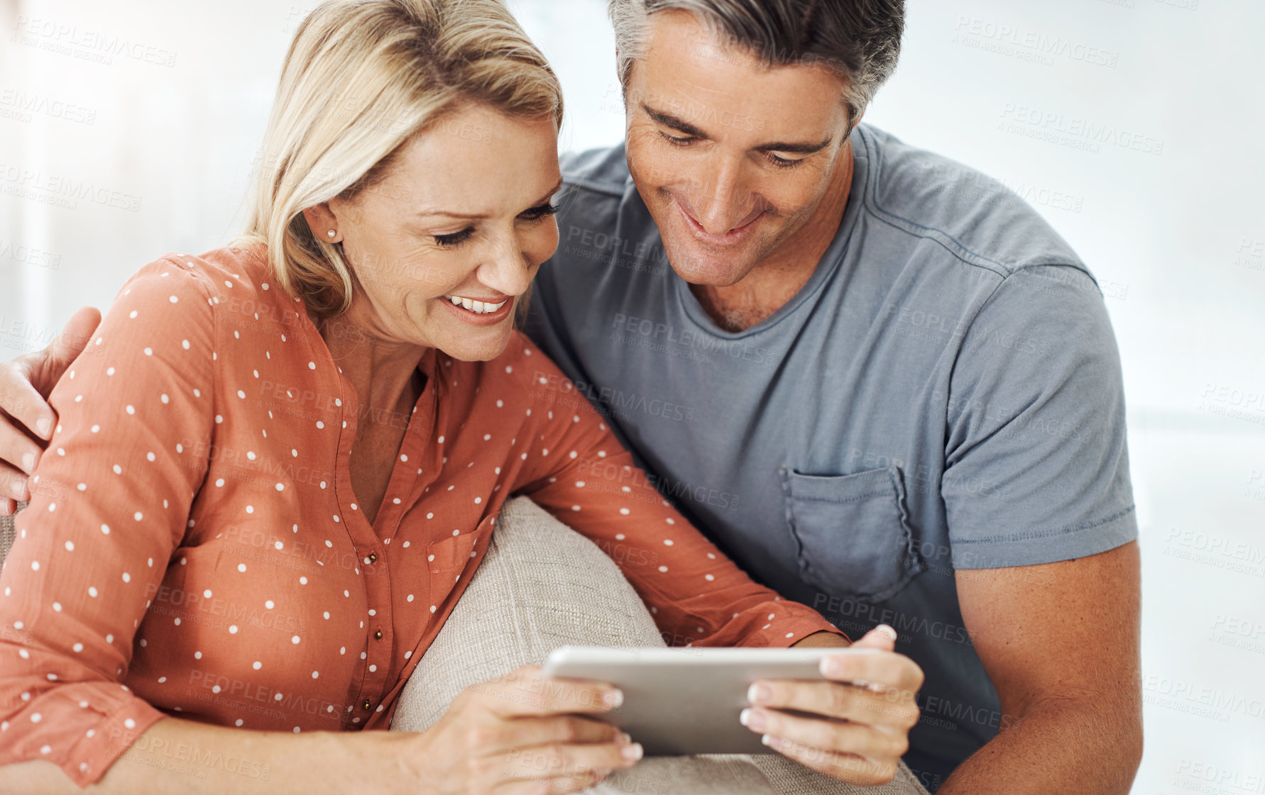 Buy stock photo Relax, smile and tablet with mature couple on sofa for streaming service, internet and connection. Technology, digital and subscription app with people in living room at home for online movie