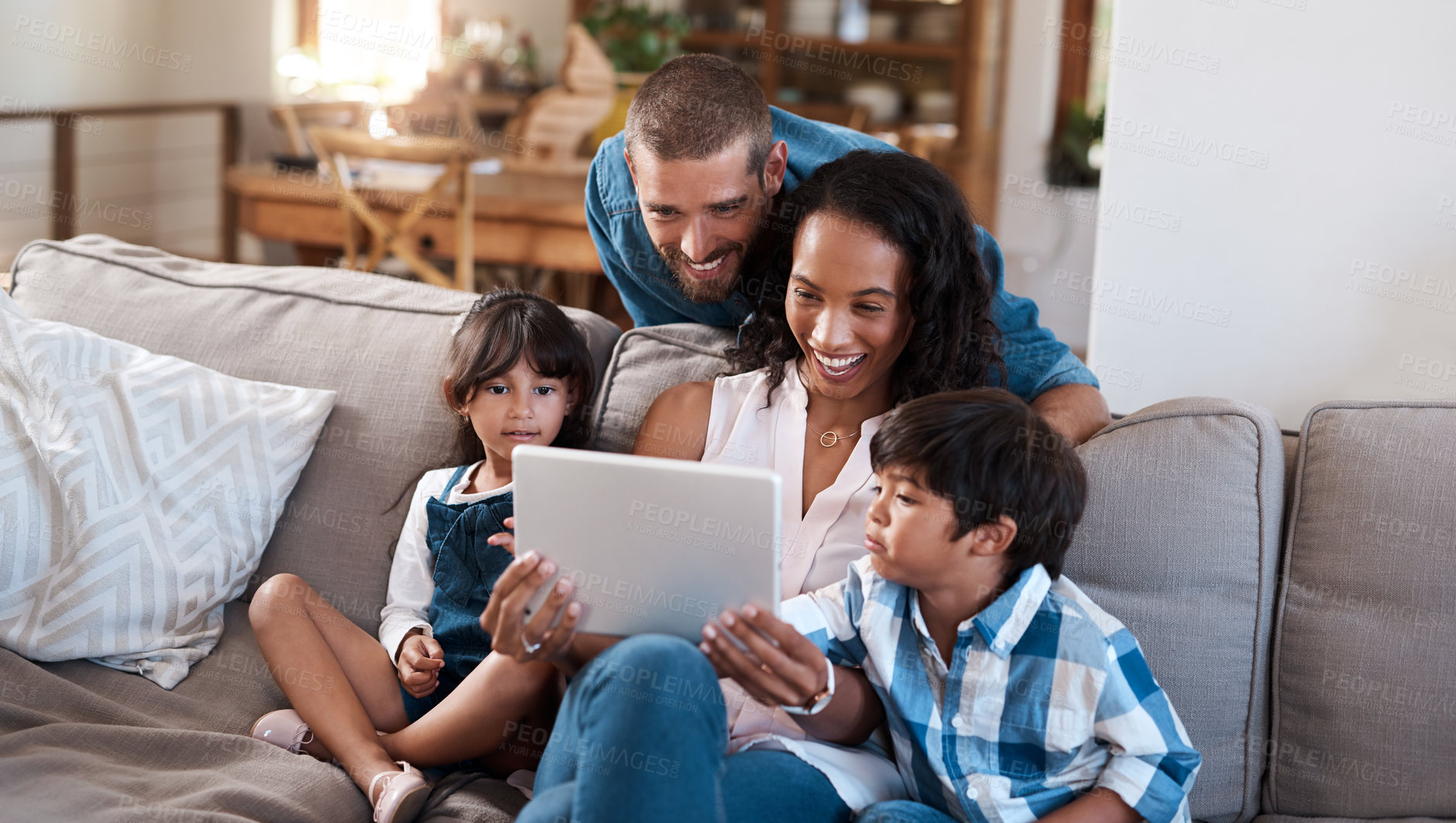 Buy stock photo Kids, parents and happy family with tablet in home for learning, education or streaming cartoon. Children, father and mother with technology for funny movie, laugh or interracial people relax on sofa