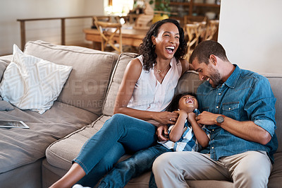 Buy stock photo Shot of a young boy being tickled by his parents