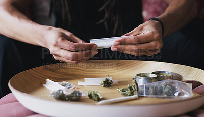 Buy stock photo Person, hands and rolling cannabis for blunt in house, weed and prepare joint for smoking. Herbal pharmaceutical, 420 and hallucinogenic in marijuana, holistic and stress relief for mental health