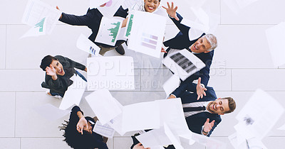 Buy stock photo Aerial shot of a diverse group of businesspeople throwing paperwork in the air in celebration while in the office
