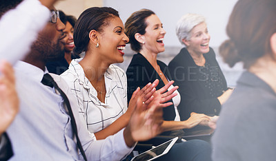 Buy stock photo Cropped shot of a diverse group of businesspeople sitting and clapping while in the office during the day