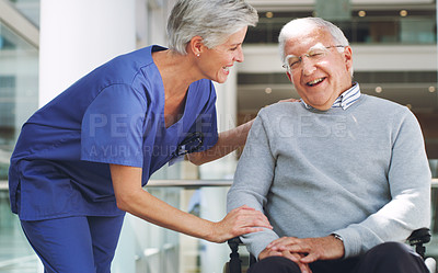 Buy stock photo Cropped shot of a happy senior man sitting in a wheelchair while his attractive mature nurse aid assists him indoors