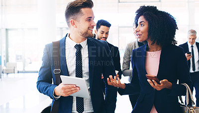 Buy stock photo Business people, technology and walking with team communication on global corporate networking, connection and ideas. Tablet, smartphone and multimedia professional worker travel and talk in a lobby