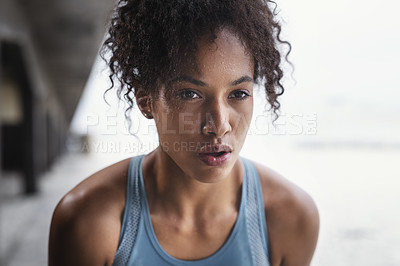 Buy stock photo Shot of an attractive young sportswoman taking a break while exercising outdoors