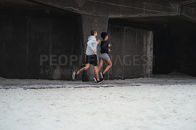Buy stock photo Full length shot of sporty young couple running together outdoors
