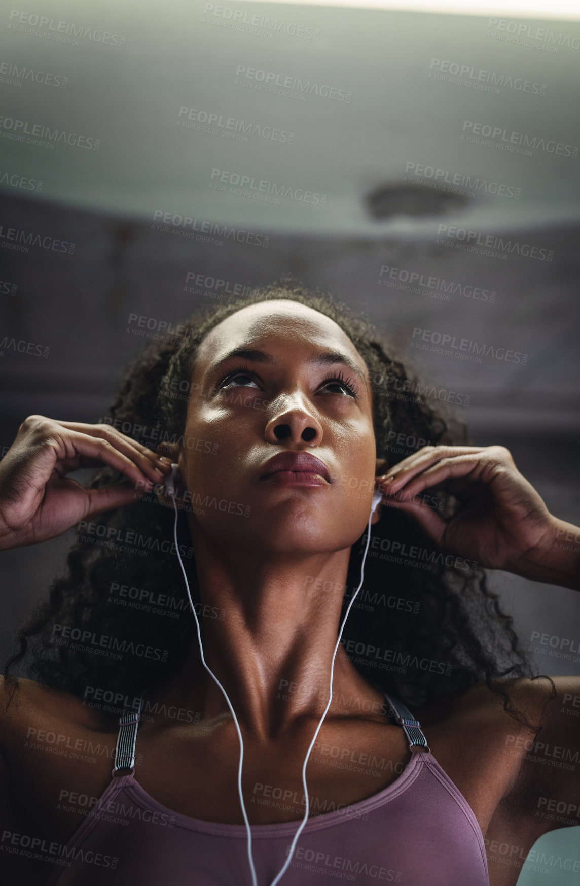 Buy stock photo Fitness, music or face of woman in gym for commitment, determination or mindset for sport. Female athlete, earphones or serious with mockup for workout, thinking or drive from favorite song on radio