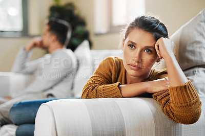 Buy stock photo Shot of a young woman ignoring her boyfriend after having an argument