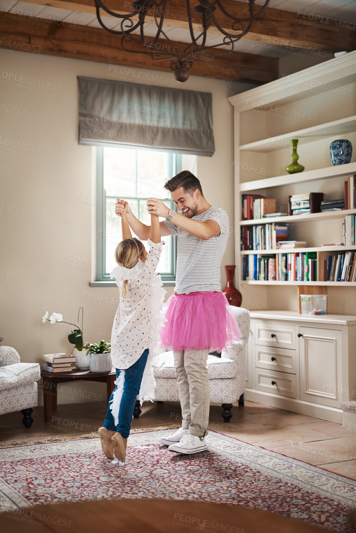 Buy stock photo Dance, ballet and father with daughter in living room for celebration, happy or energy. Music, princess and trust with man and helping young girl in family home for support, learning or holding hands