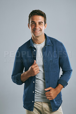 Buy stock photo Cropped shot of a handsome man posing against a grey background