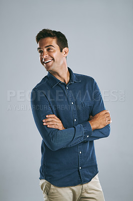 Buy stock photo Cropped shot of a handsome man posing against a grey background