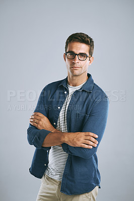 Buy stock photo Cropped shot of a handsome man wearing glasses against a grey background