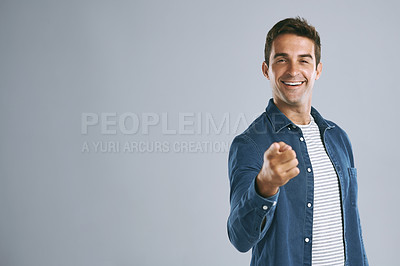 Buy stock photo Cropped shot of a handsome man pointing at the camera