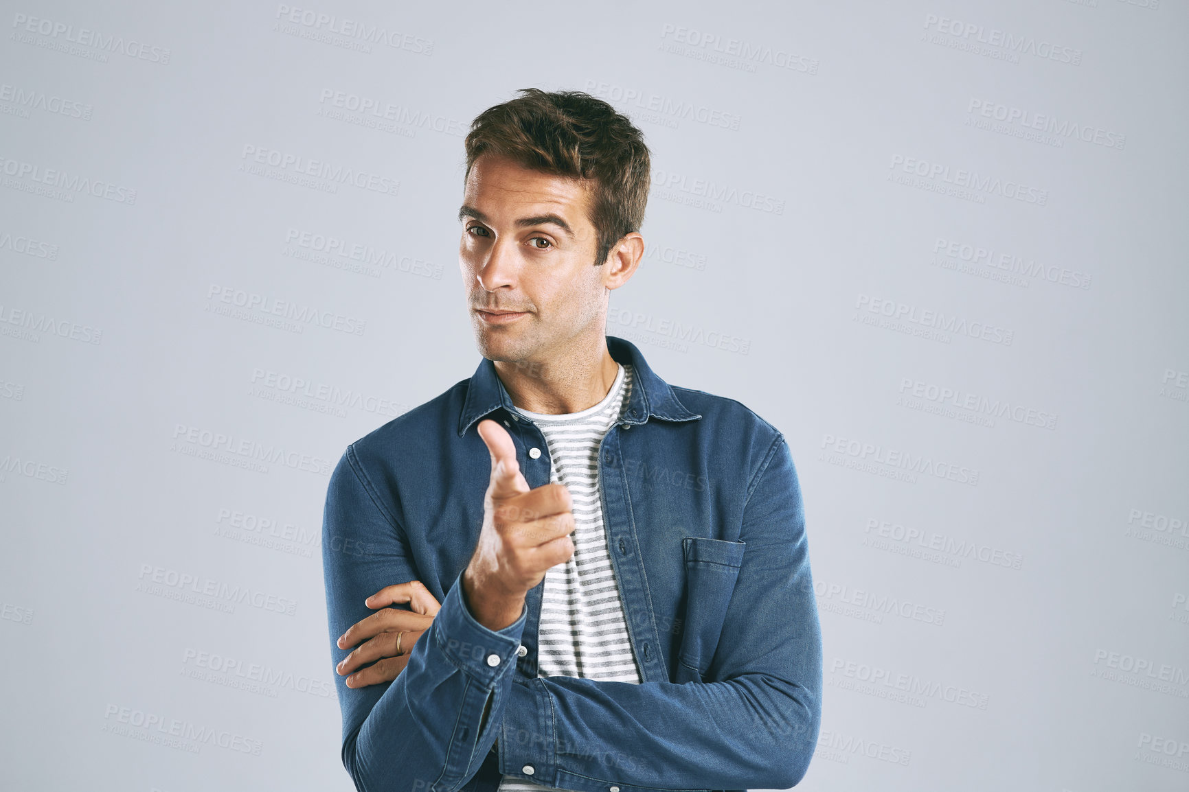 Buy stock photo Cropped shot of a handsome man pointing at the camera