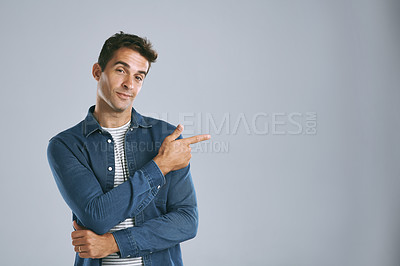 Buy stock photo Cropped shot of a handsome man advertising copyspace
