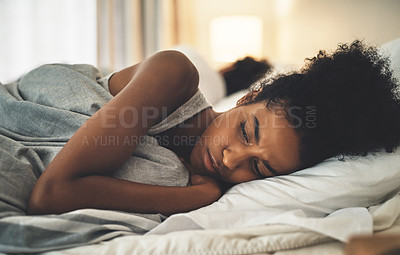 Buy stock photo Sad woman lying on a bed in an unhappy marriage having problems. Upset female or couple in the bedroom after having an argument. Depressed lady in conflict with her husband.