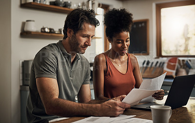 Buy stock photo Finance, couple and laptop in a kitchen for planning, budget and savings or paying bills together in their home. Marriage, online and people with documents for tax, mortgage or home loan or insurance