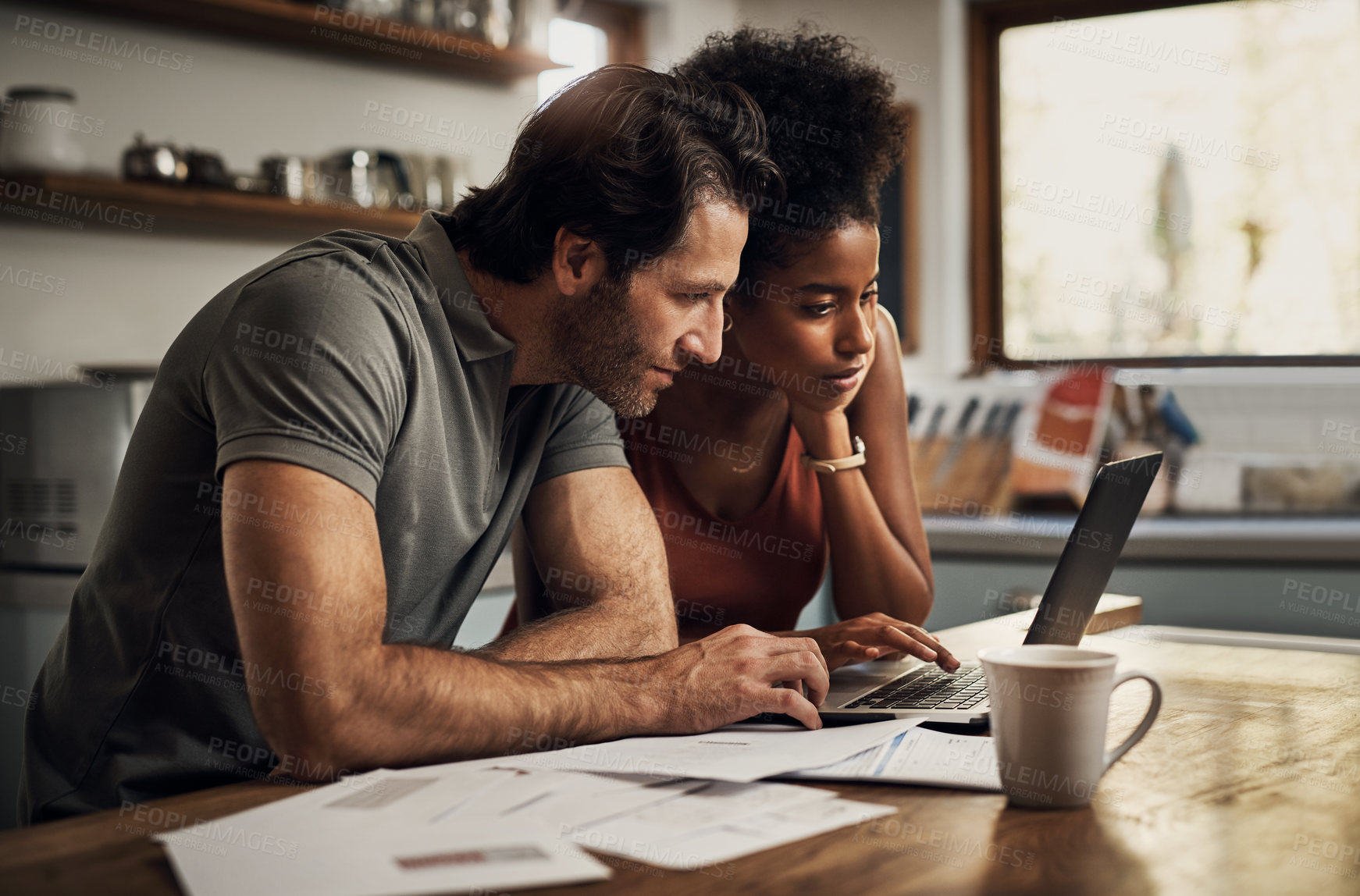 Buy stock photo Couple with a laptop doing finance paper work, paying debt insurance loans or online ebanking together at home. Two serious people planning and looking at financial document, bills rate for mortgage