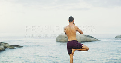 Buy stock photo Man, yoga and tree pose for balance at sea or wellness peace for vrksasana, rear view or mindfulness. Male person, chakra and zen exercise at ocean or holistic resort or spirituality, healing or calm
