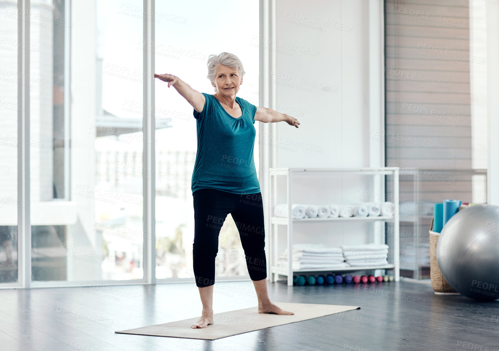 Buy stock photo Senior woman, yoga stretching and exercise for holistic wellness, chakra healing and warrior pose in gym studio. Elderly lady, fitness and pilates class for balance, zen workout and retirement health