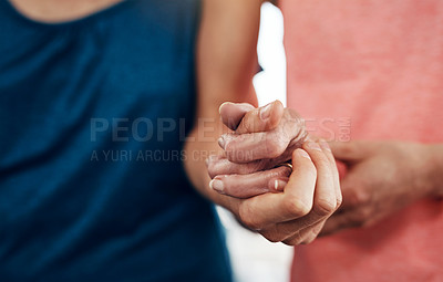 Buy stock photo Closeup shot of an unrecognisable young woman holding a senior woman's hand