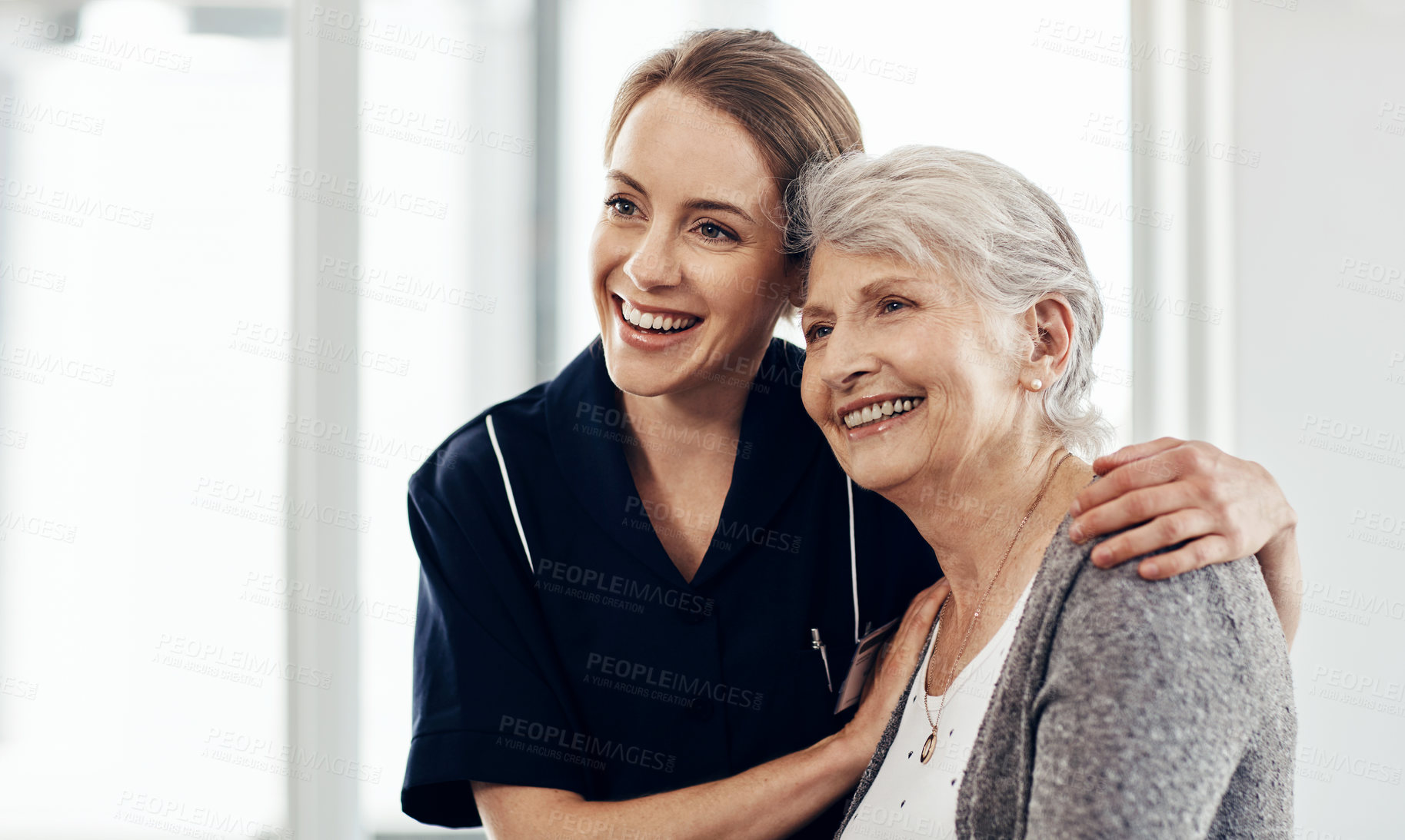 Buy stock photo Cropped shot of a female nurse caring for a senior woman