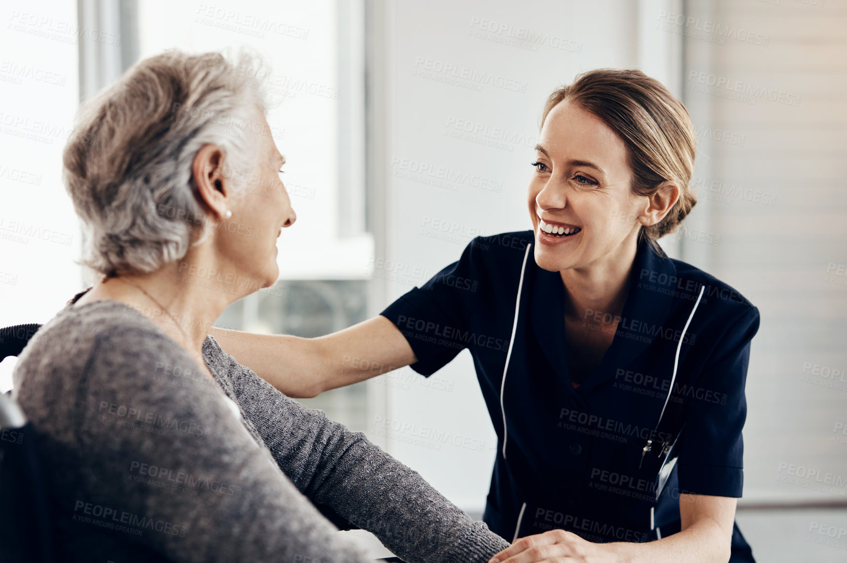 Buy stock photo Senior woman, comfort and nurse with support for healthcare, empathy or trust in elderly care or retirement at home. People, caregiver and touching person with a disability for help, love and smile