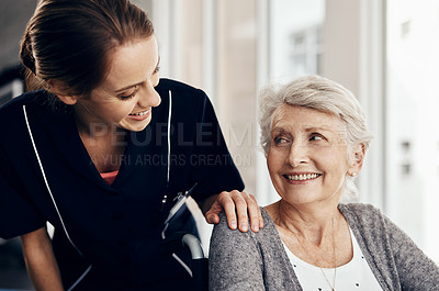 Buy stock photo Cropped shot of a female nurse caring for a senior woman in a wheelchair