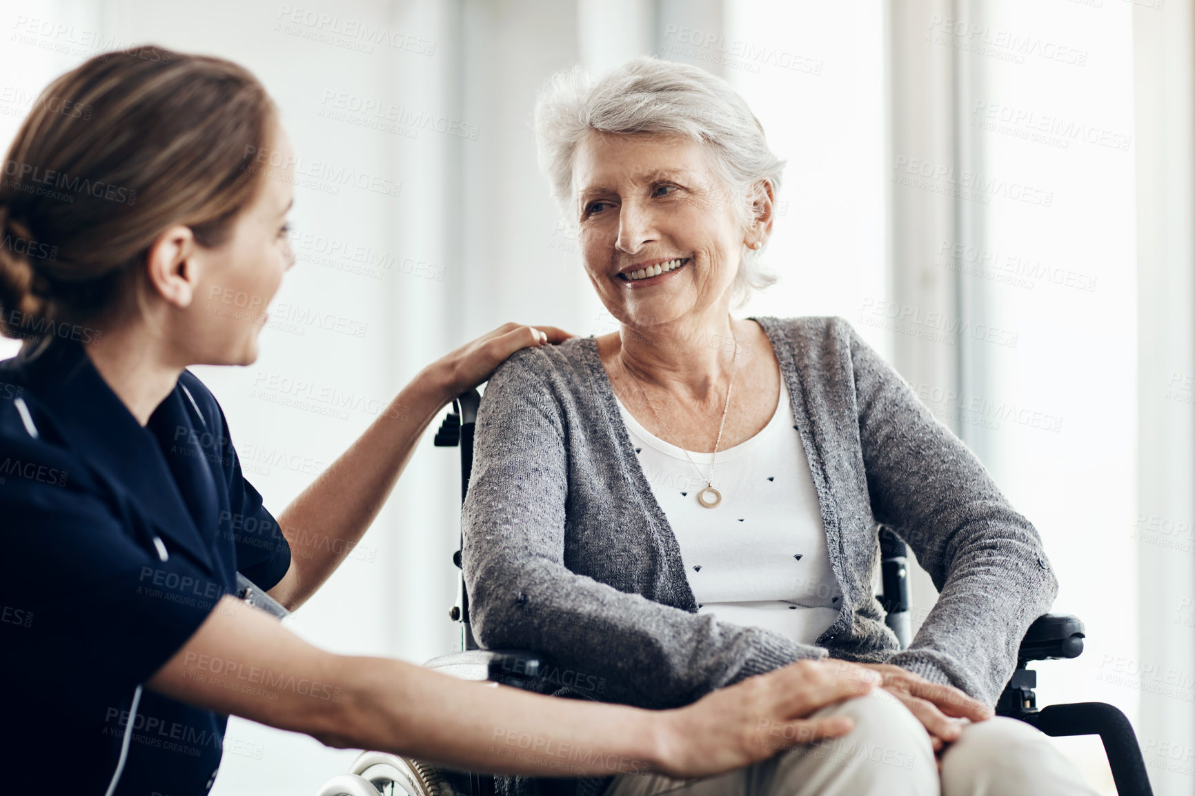 Buy stock photo Help, nurse and senior woman in wheelchair for assistance, support or medical care in retirement home. Discussion, friendly caregiver and elderly patient with disability for wellness, health or trust