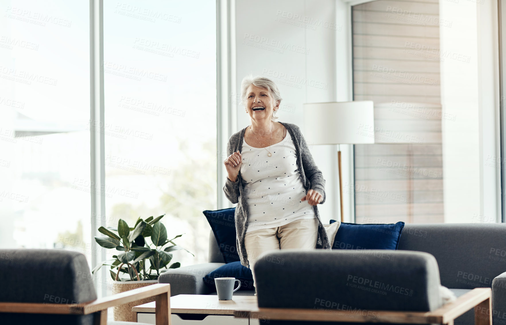 Buy stock photo Senior woman, happy and dancing in living room with music, radio and smile in retirement home. Funny, laughing and listening in a lounge with audio, fun and excited from wellness, health and mobility