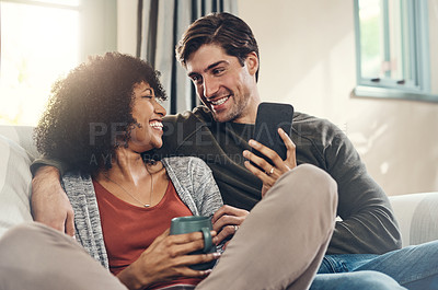 Buy stock photo Shot of an affectionate couple spending some quality time together in their living room at home