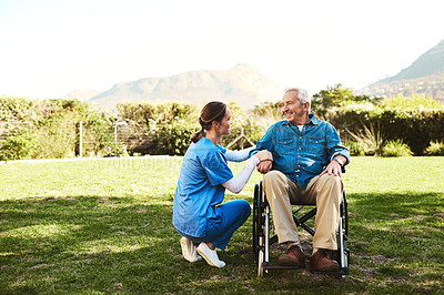 Buy stock photo Senior man, nurse and wheelchair in nature for healthcare support, life insurance or garden at nursing home. Happy elderly male and woman caregiver helping person with disability or patient outdoors