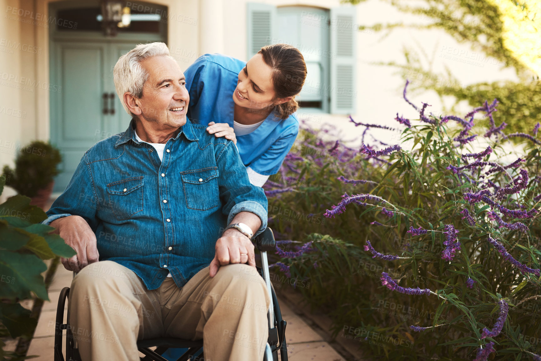 Buy stock photo Senior man, nurse and wheelchair in elderly care, talking or healthcare support at nursing home. Happy mature male and woman caregiver walking patient, person with a disability in retirement outdoors