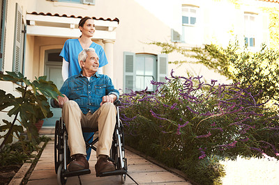 Buy stock photo Senior man, nurse and wheelchair for walk, relax or healthcare support in garden at nursing home. Happy elderly male and woman caregiver walking patient with a disability or retirement in nature